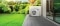 La imagen muestra una bomba de calor monobloc Carrier AquaSnap 30AWH-P en la terraza de una vivienda unifamiliar.
